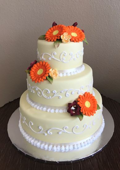 Picture of Yellow Spring Scrolled Wedding Cake